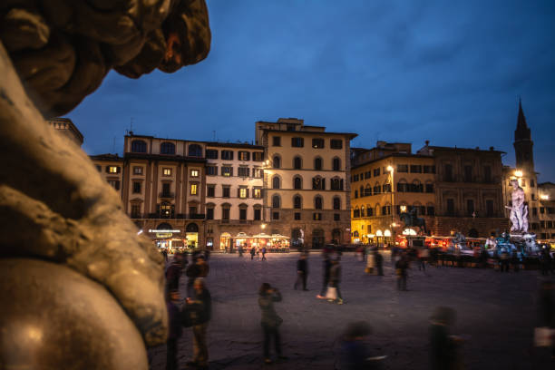 Palazzo Vecchio and statues in Piazza della Signoria at sunset