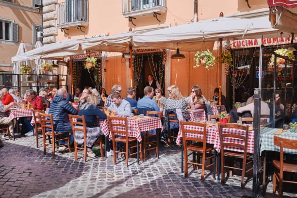 Local Roman trattoria with people dining and enjoying espresso — eating out in Rome like a local.