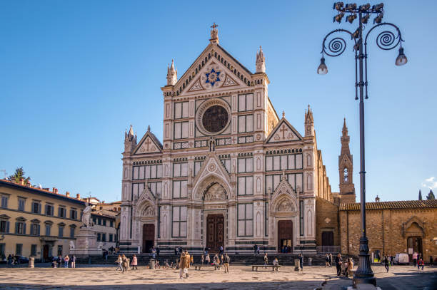 Interior of Basilica of Santa Croce with tombs and frescoes in Florence Italy