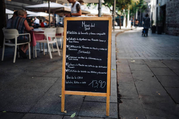 Chalkboard handwritten menu outside a traditional Roman trattoria — a sign of authentic local food in Rome.