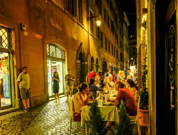 Family tasting pizza and gelato on an evening food tour in Rome