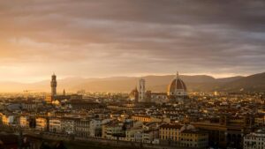 Florence skyline at golden hour sunset seen from Piazzale Michelangelo with Duomo and Arno River