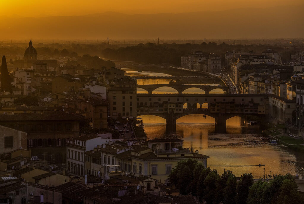 Florence skyline with Arno River at sunset featuring Ponte Vecchio and Duomo – unique things to do in Florence Italy and famous sights in Tuscany