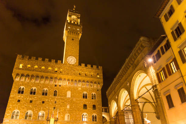 Palazzo Vecchio and Piazza della Signoria illuminated at night in Florence Italy