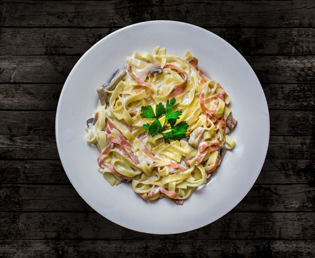 “Traditional Roman Carbonara pasta with guanciale and Pecorino Romano cheese in Rome, Italy.