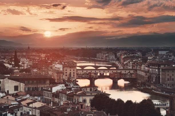 Ponte Vecchio bridge over the Arno River at sunset, Florence Italy”