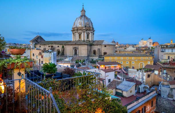 Rooftop terrace view of St. Peter's Basilica at dusk Rome Italy evening