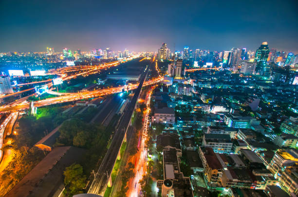  Silom district night market and skyline view in Bangkok.