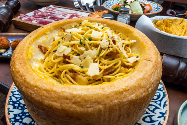 Spaghetti Parmigiana flambé at Trattoria Vecchia Roma – famous food in Rome Italy