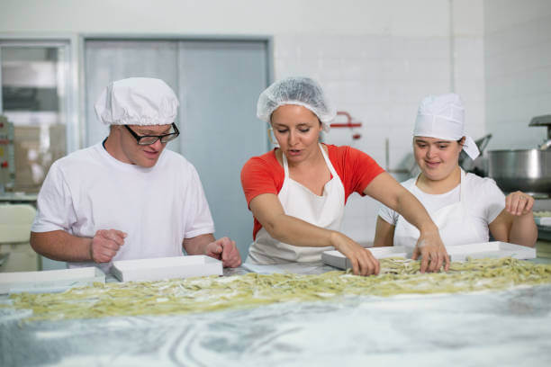 Tourists participating in a pasta cooking class in Florence