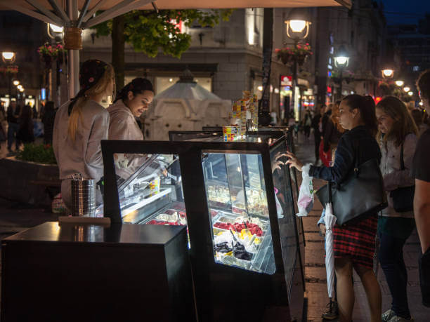 Travelers enjoying local Roman dishes during a nighttime food tour