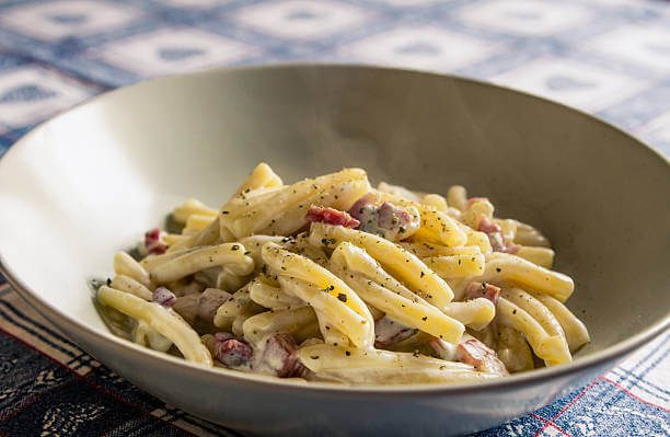 Traditional Roman Cacio e Pepe pasta with Pecorino Romano cheese and black pepper in Rome Italy
