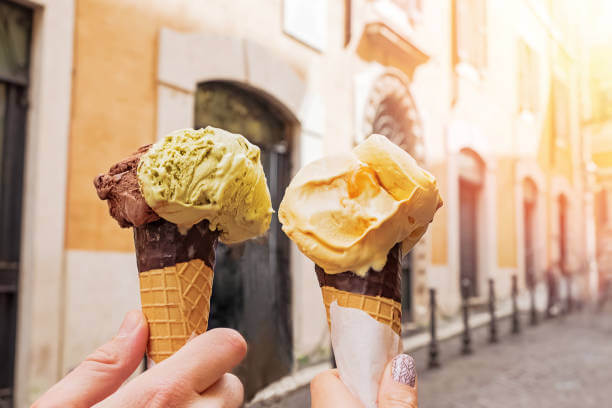 Artisanal gelato cones with pistachio and ricotta fig flavors in Rome.