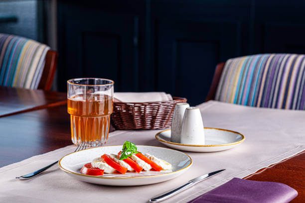 Fresh Caprese salad with creamy mozzarella, vine-ripened tomatoe