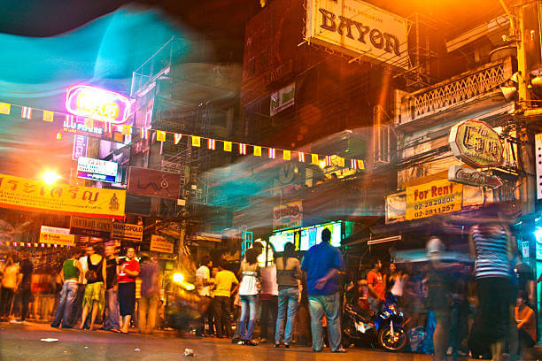 Khao San Road nightlife in Bangkok with bars, music, and backpacker crowds