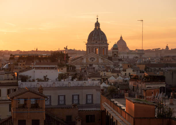  Panoramic view of Rome city skyline with domes and rooftops at sunset