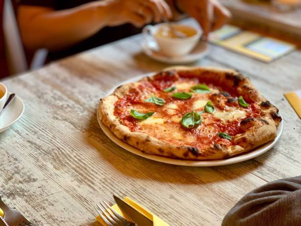 Pizza Margherita served at a traditional Roman trattoria during a 2 Day Rome Itinerary dinner
