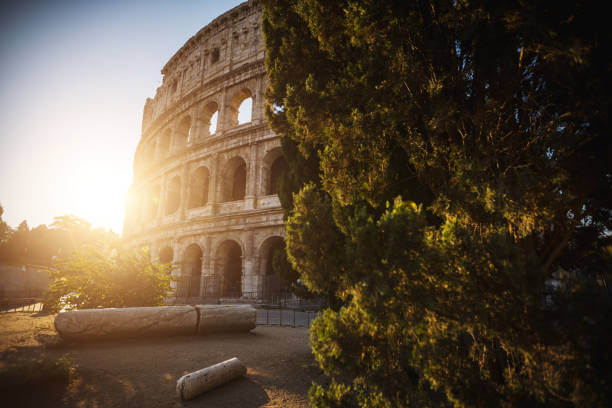 The Colosseum at sunrise, showcasing its ancient arches and grandeur