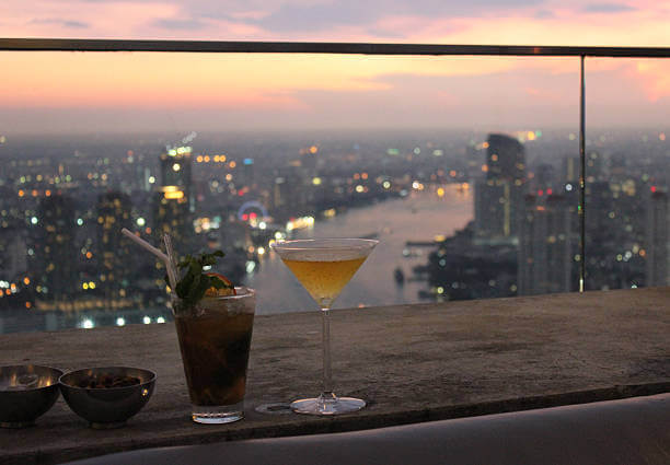 Bangkok rooftop bar with sunset cocktails, skyline views, and romantic ambiance