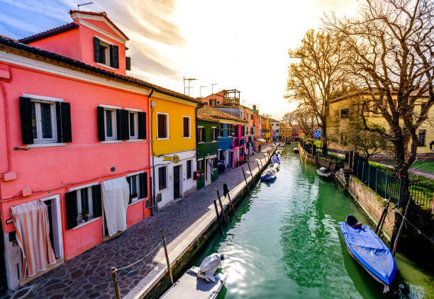 Colorful houses lining a canal on the island of Burano near Venice