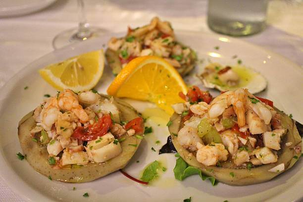 Cicchetti in Venice Italy on slices of bread with seafood and cheese toppings