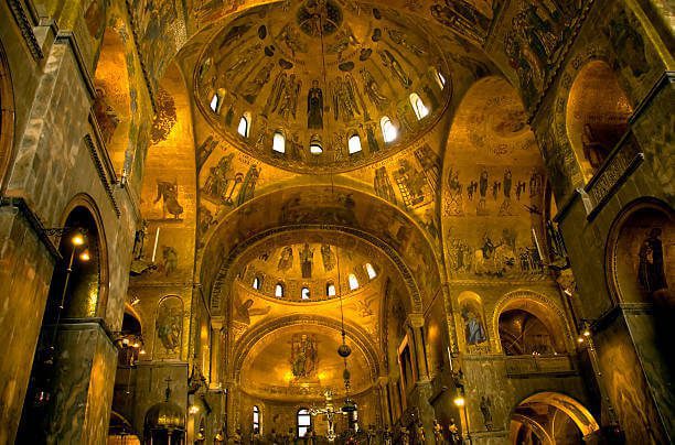  Interior of St. Mark's Basilica Venice showing golden mosaic ceiling and Byzantine domes
