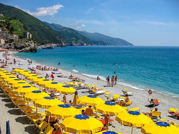 Monterosso al Mare sandy beach with umbrellas in Cinque Terre one of the best things to do in Cinque Terre