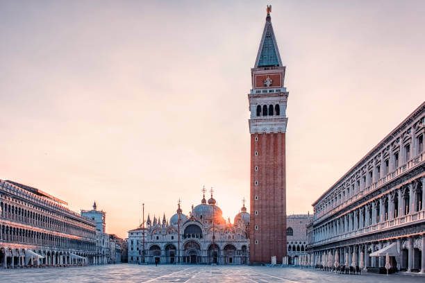  Piazza San Marco Venice Italy early morning with no tourists and golden sunrise light