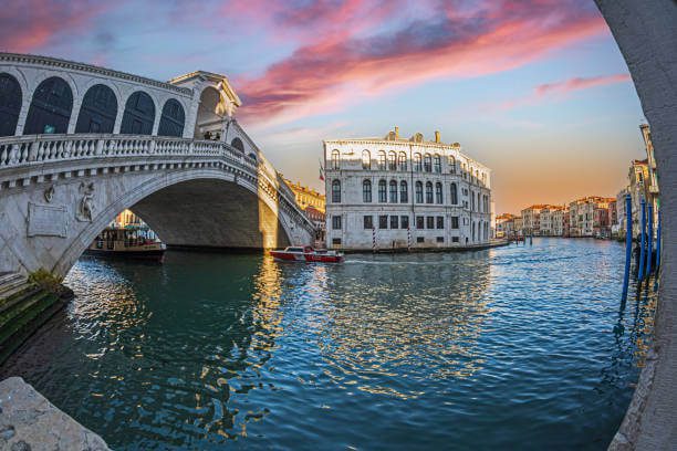 Rialto Bridge Venice Italy at sunrise with Grand Canal