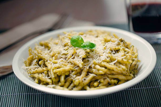 pesto pasta and local white wine from Cinque Terre Italy a tasty way to enjoy things to do in Cinque Terre