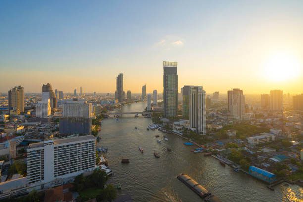Bangkok skyline at golden hour with Chao Phraya River