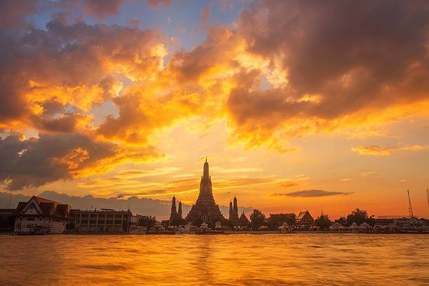 Wat Arun temple at sunset from Chao Phraya River