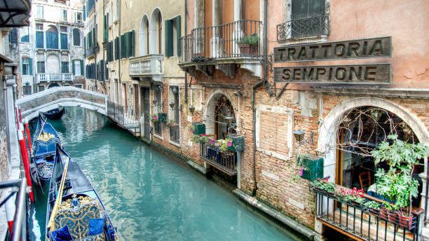 best boutique hotels in venice mid-range room venetian decor canal view