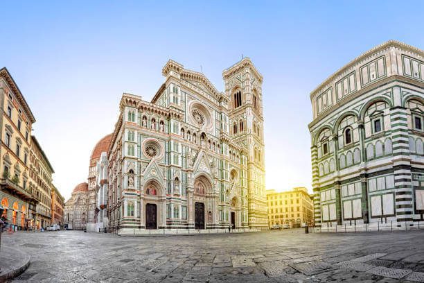 where to stay in Florence for first time Piazza del Duomo with Florence Cathedral marble facade at sunrise