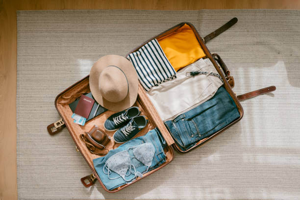 Flat-lay packing layout for Italy weather in October light layers