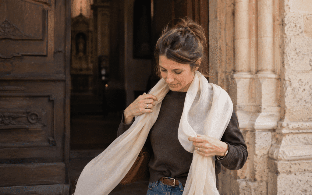 travel tips for italy in october Italian etiquette tip woman draping a light scarf 