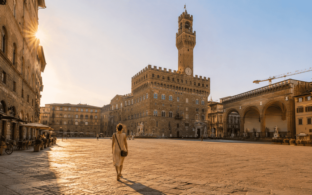 Getting around florence solo travel guide walking across Piazza della Signoria in morning light
