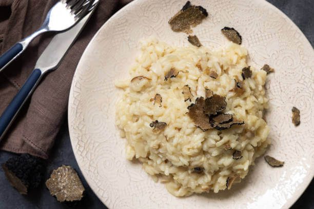 What to eat on Italy October itinerary plate of fresh truffle tagliatelle pasta