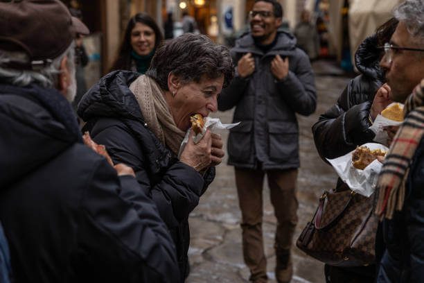 Florence budget food for solo travelers lampredotto sandwich €4 at Nerbone Mercato Centrale and fresh schiacciata flatbread representing the cheapest authentic food in Florence