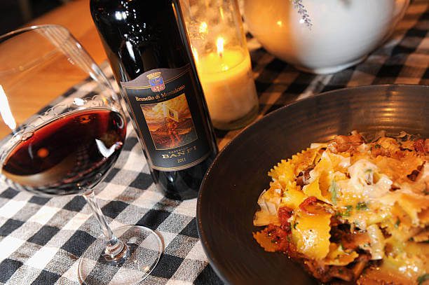 Budget lunch in Florence solo fresh pasta and wine at Mercato Centrale food hall shared table for under €15